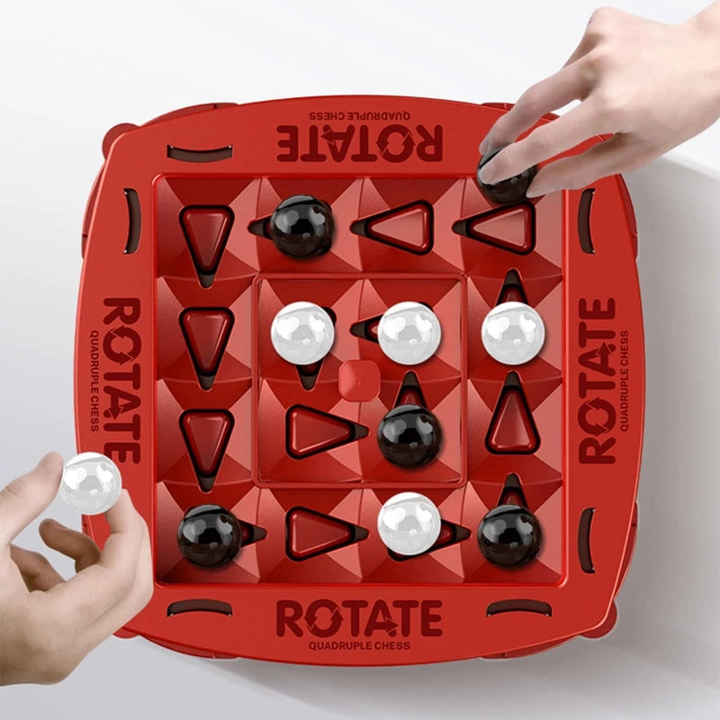 Top view of red Rotate board game grid with black and white marbles in play