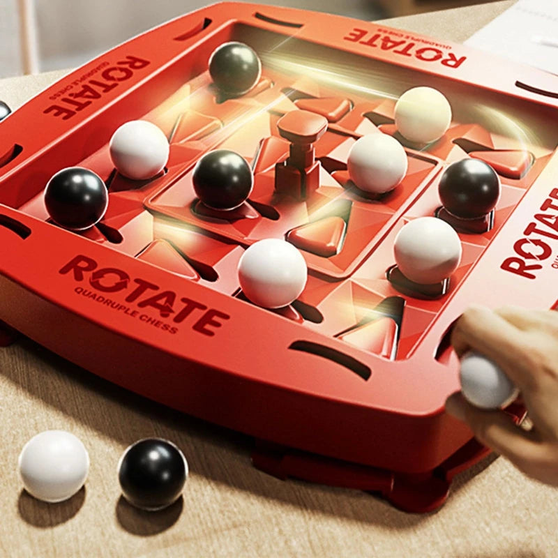 Close-up of red Rotate board game with rotating center and glossy black and white marbles